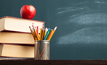Illustrarion of books, apple and chalk board.