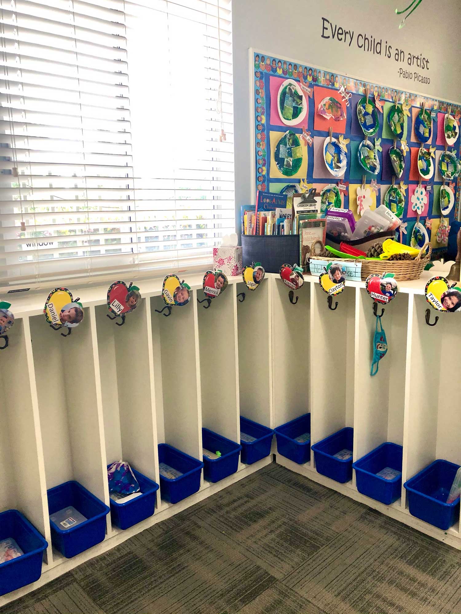 Row of Cubbies Labeled With Each Child's Photo