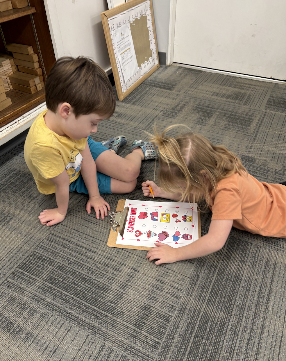 Kids Looking at Clipboard