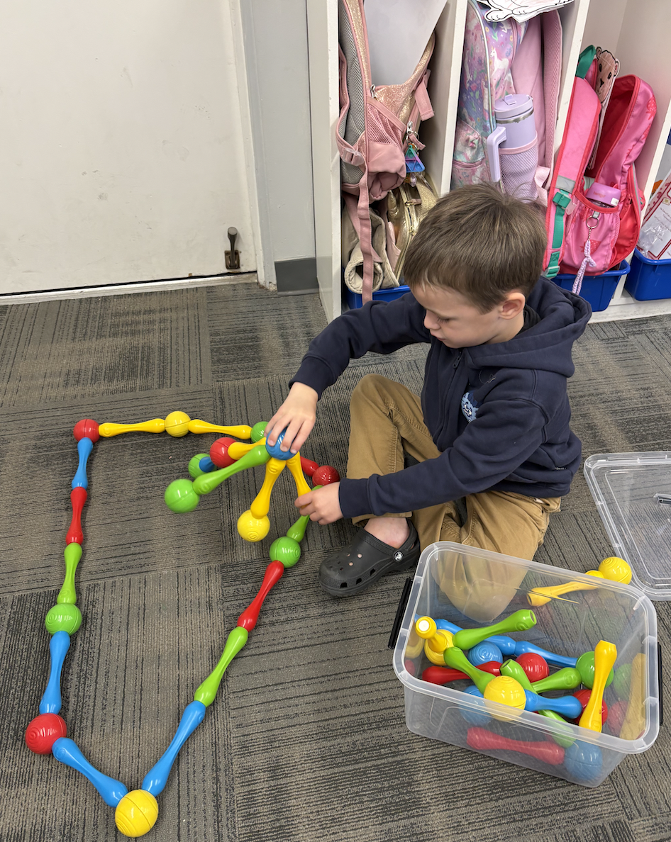 Boy Playing with Building Toy