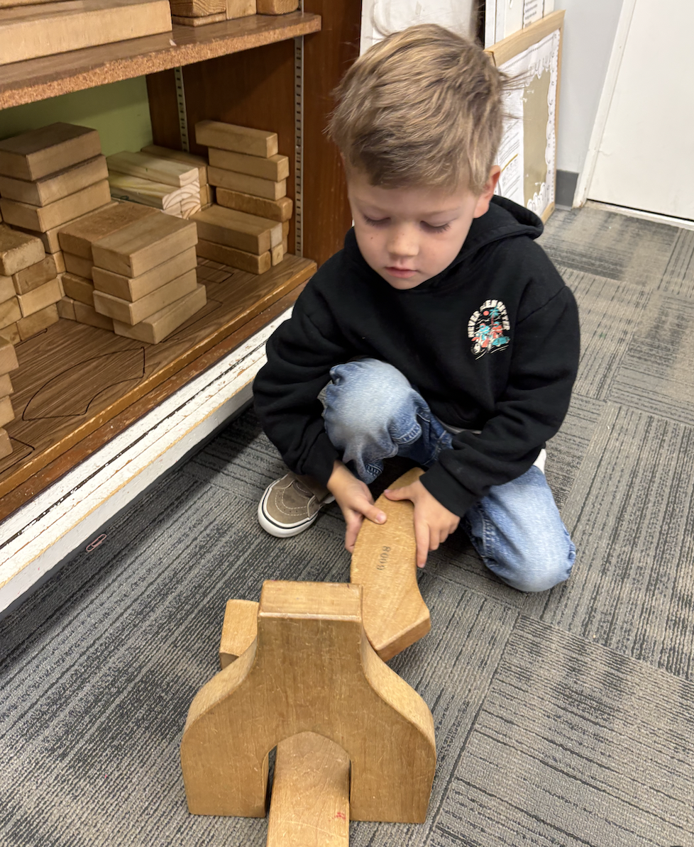 Boy Playing with Wooden Blocks