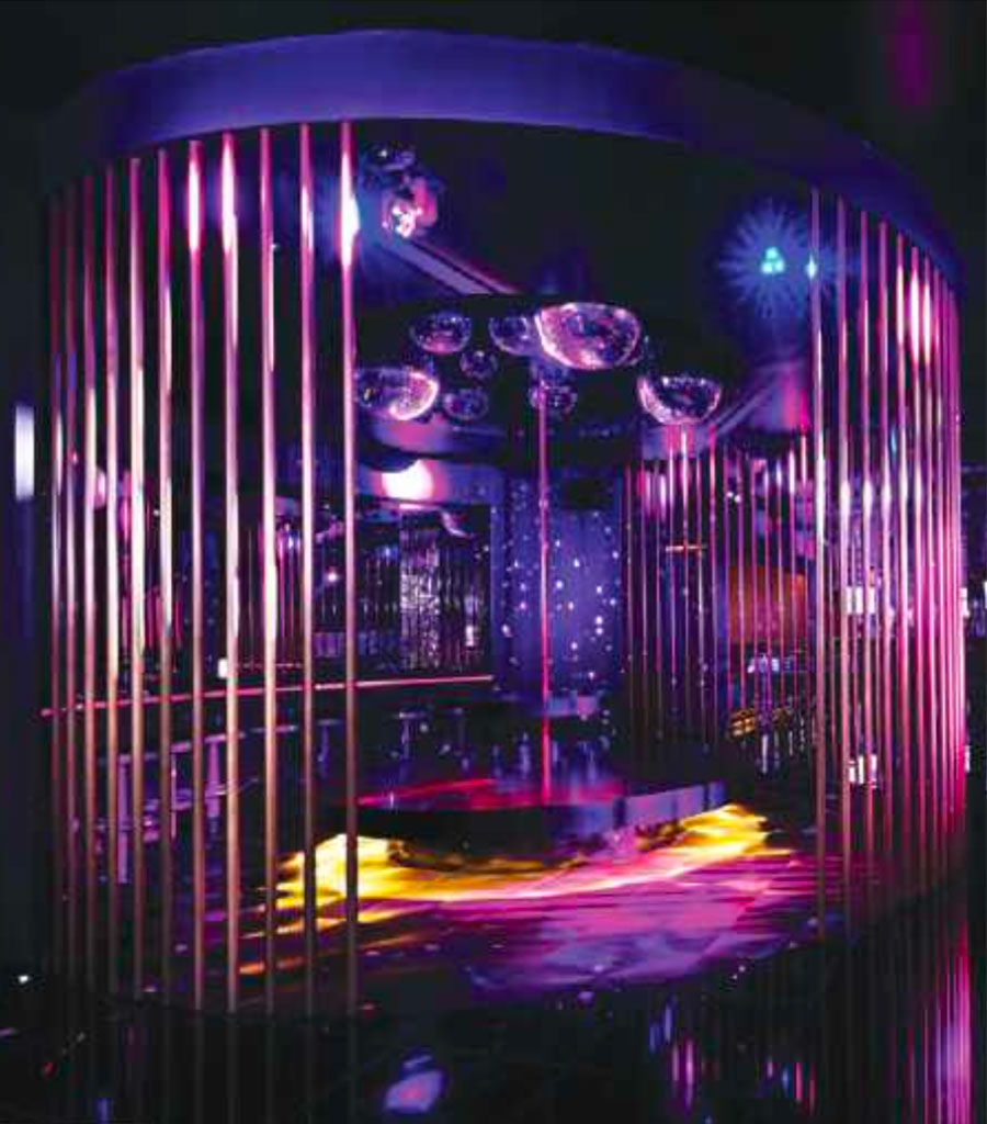Hard Rock Hotel Night Club featuring round section set off by floor to ceiling poles.