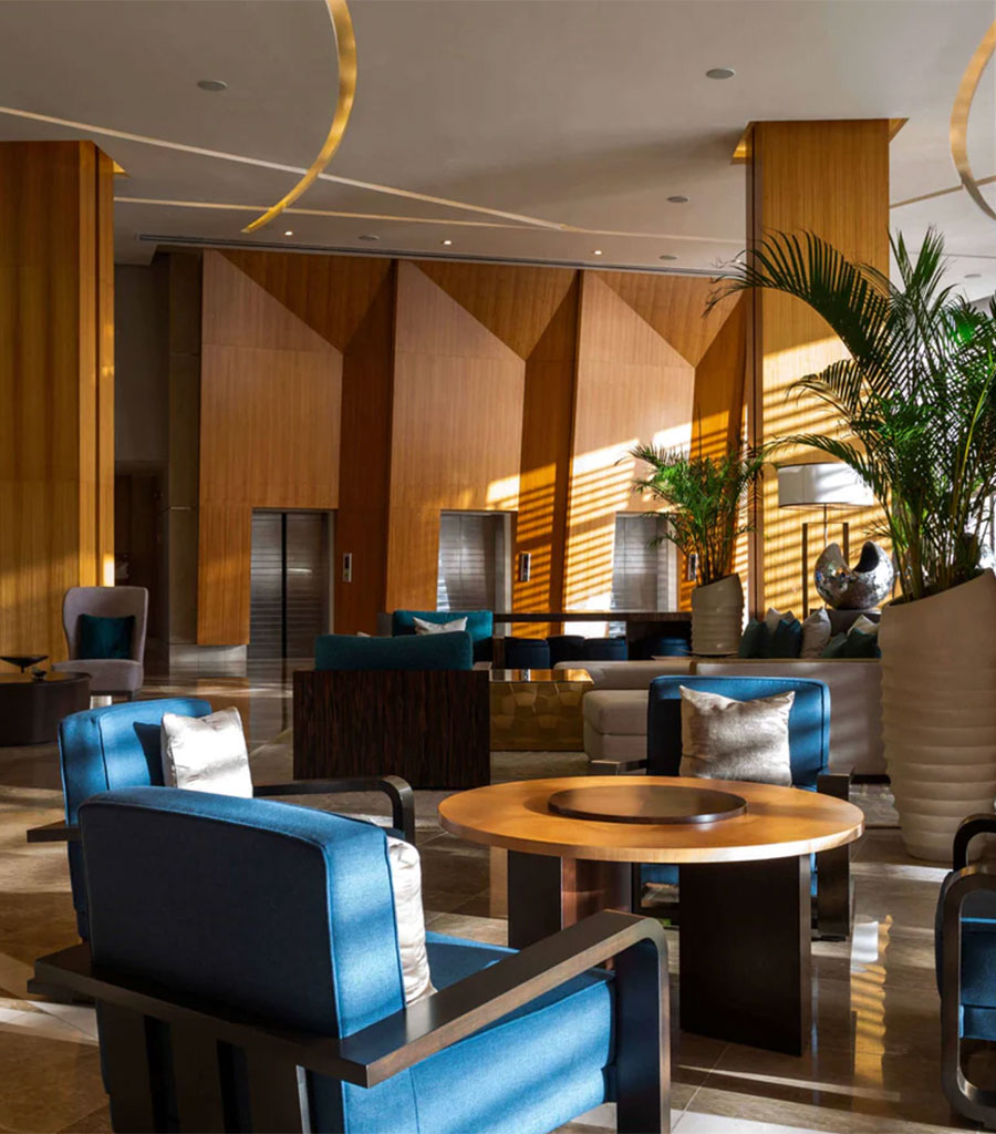 JW Marriott Panama Lobby featuring periwinkle arm chairs around a circular table.