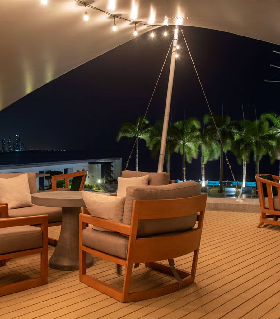 JW Marriott Panama Outdoor Deck featuring a fabric awning over seating area adjacent to the pool.