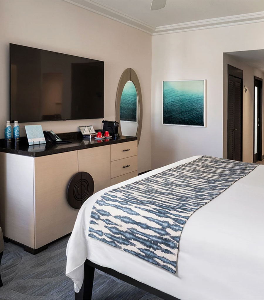 The Palms Hotel Miami guest room with cream colored furniture.